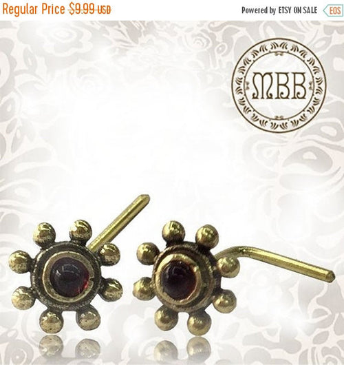 Single Ornate Tribal Flower Brass Nose Stud With Inlayed Red Garnet Stone .